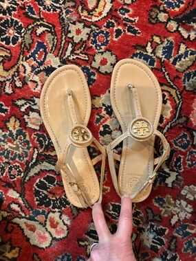 Tory Burch Nude/Beige Patent Logo Thong Sandals with Gold Medallion